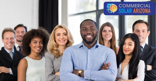 Group of employees with arms folded smiling