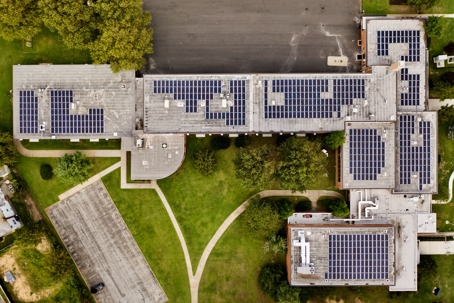 Birds eye view of building with solar panels